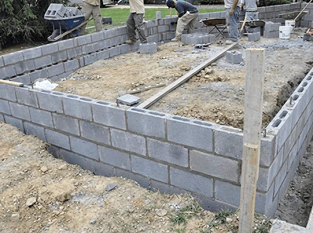 Professionals building a foundation with blocks in Raleigh, NC