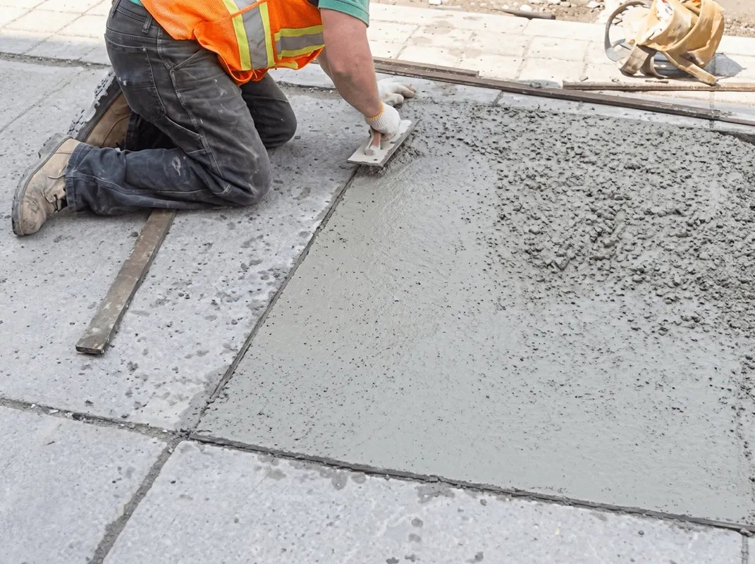 Professional repairing a concrete floor in Raleigh, NC